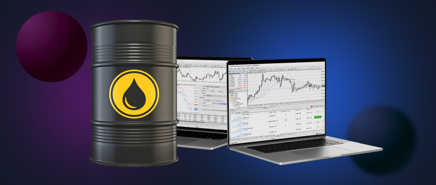 An oil barrel next to two monitors with trade commodities data.