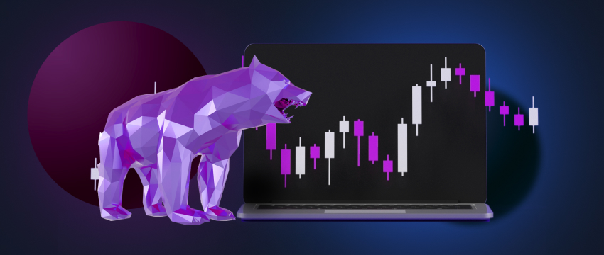 A bear standing in front of a laptop displaying candlestick charts and essential technical indicators