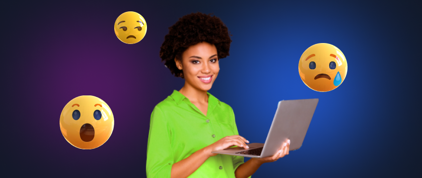 A trader holding a laptop surrounded by a variety of emojis, depicting the range of emotions in trading.