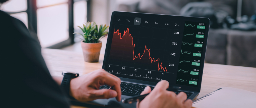 Laptop showing a forex market chart, highlighting key analysis for forex traders' success and strategic goals.