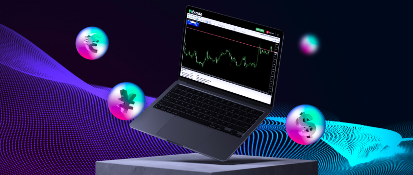 A laptop showing a graph that highlights the lowest spreads for various currencies on forex platforms.